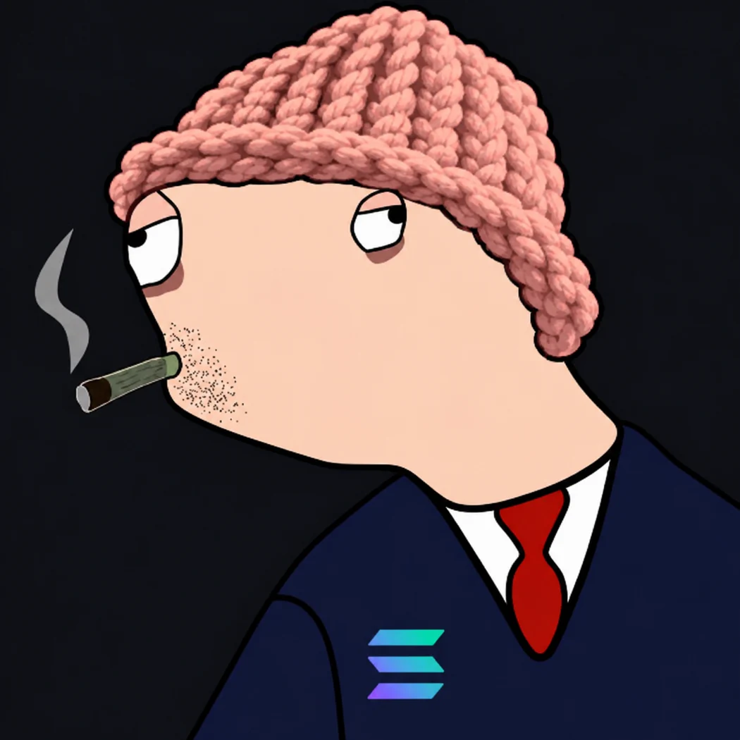 Hunter Wif Boden wearing a salmon knit hat, navy suit, and red tie